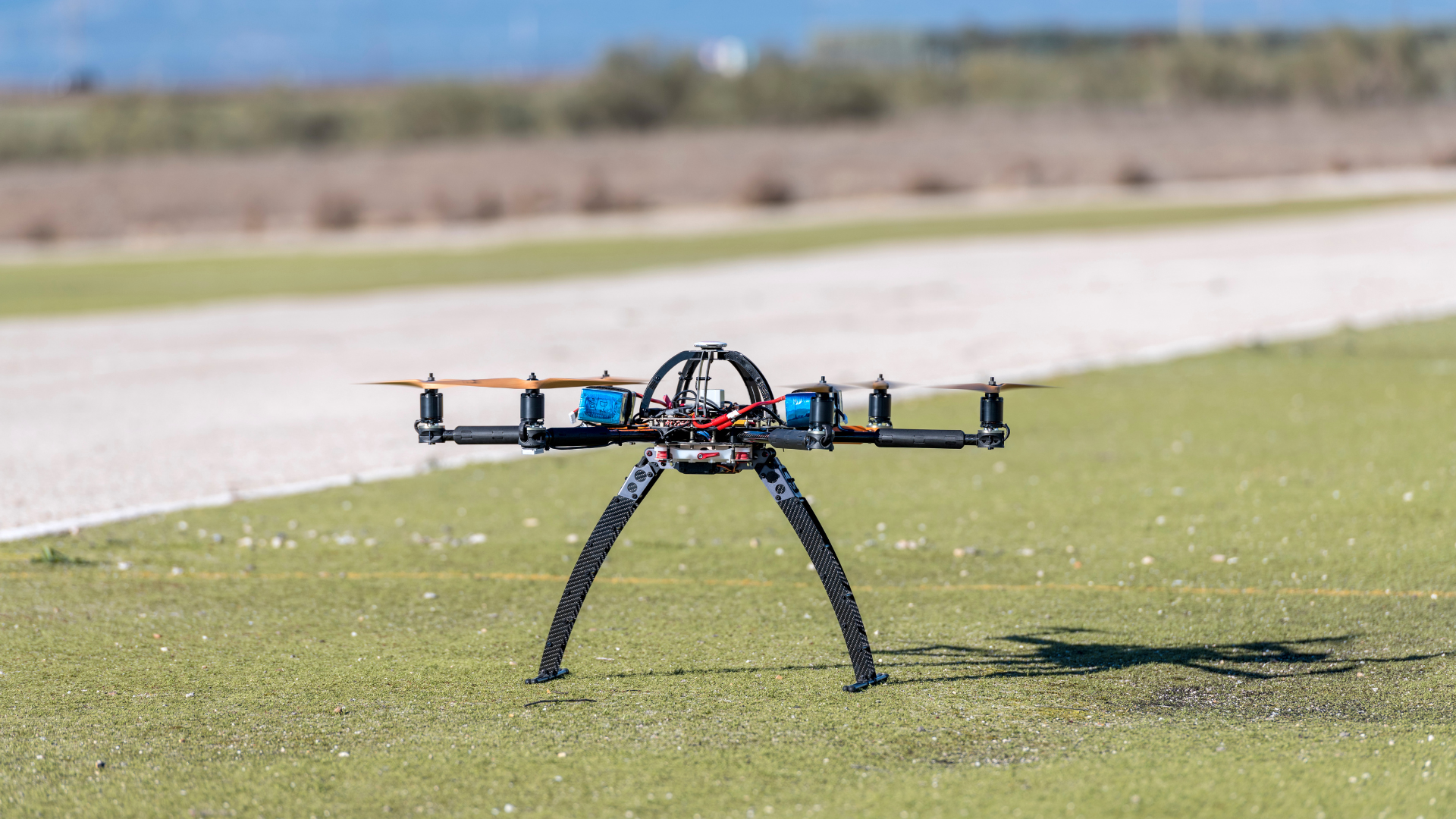 Drone sitting on grass.