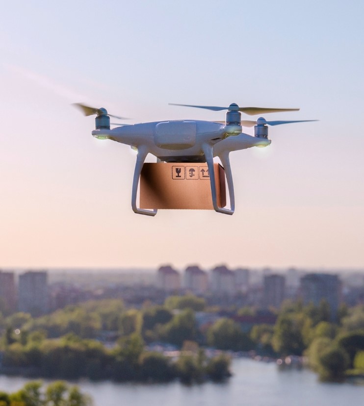 A flying drone carrying a delivery